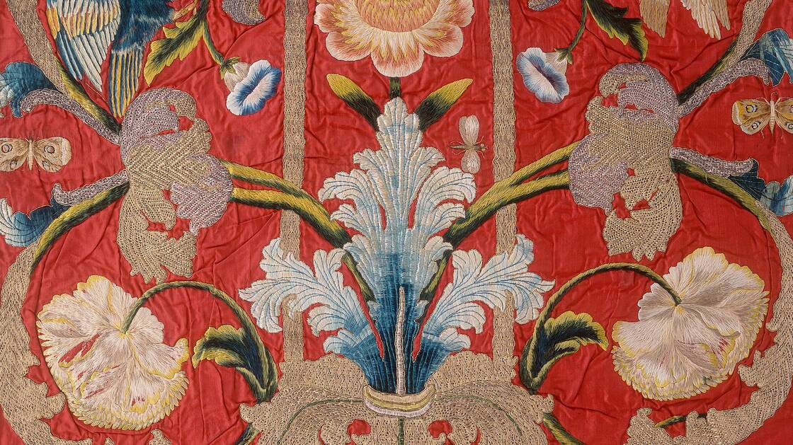 Detail of a chasuble with colourful, naturalistic embroidery and symmetrically arranged floral and bird pattern with rocailles, 1725 - 1750